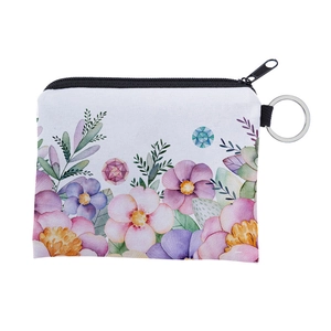Detail of floral print coin purse with watercolor flowers and silver key ring attachment