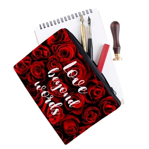 Detailed view of floral makeup bag with Love Beyond Words print and red roses