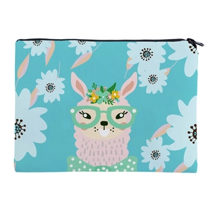 Macro view of blue canvas makeup bag featuring a cute cartoon alpaca and floral patterns