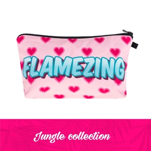 Detailed close-up of pink cosmetic bag with heart print and FLAMEZING blue typography