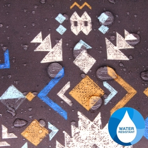 Close-up of geometric pattern fabric showing clear water-resistant droplets on surface