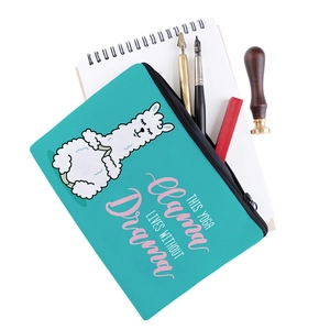 Detail of teal yoga llama makeup bag showing the printed slogan and sturdy black zipper