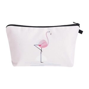 Detailed view of the cute flamingo print on the white canvas cosmetic travel bag