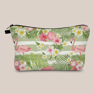 Detailed view of tropical bird print on cosmetic bag with flamingo and floral pattern