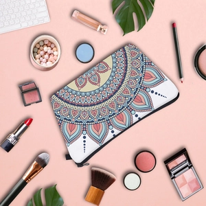 Detailed top view of a mandala pattern makeup bag with stylish cosmetic accessories