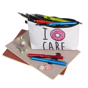 White canvas donut makeup bag with I Donut Care print and zipper for travel storage
