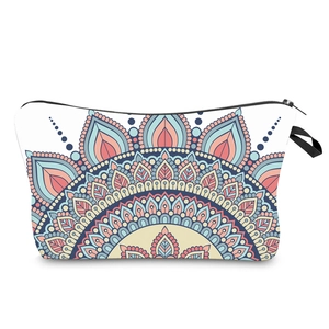 Detail of canvas toiletry bag featuring colorful mandala pattern and black zipper handle