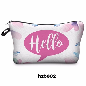 Portable floral zipper makeup bag with pink Hello print and black handle strap