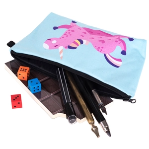 Detail of light blue unicorn makeup pouch with stationery and chocolate notebook