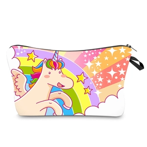 Detail view of colorful unicorn and rainbow print on white canvas travel makeup bag