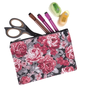 Floral makeup organizer with red roses pattern and stationery accessories shown