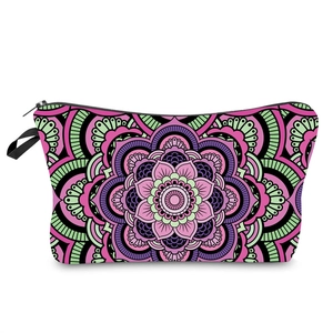Detail of colorful Mandala pattern cosmetic bag with black zipper and wristlet strap