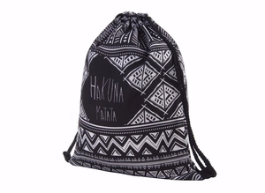 Black canvas drawstring bag with white ethnic geometric patterns and Hakuna Matata text