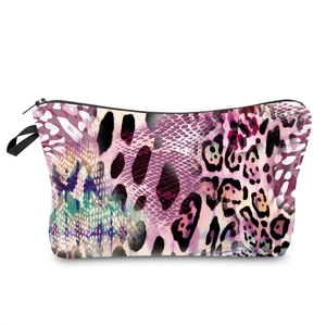 Detail showing high-quality leopard print patterns and durable zipper on the travel bag