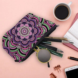 Mandala floral multipurpose makeup bag and travel organizer on a pink surface