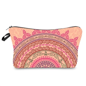 Close-up of pink mandala print makeup bag featuring a smooth black zipper and wristlet