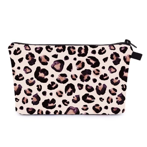 Detail view of leopard print makeup bag showing the smooth black zipper and fabric texture