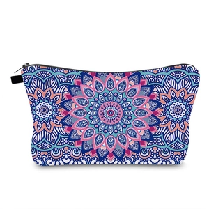 Detail of colorful mandala pattern makeup bag with black zipper on white background