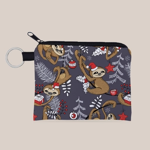 Detail of sloth Christmas print coin purse with a secure silver metal keychain ring