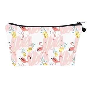Summer themed makeup bag with pink flamingo and pineapple prints on white background