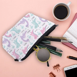 Cosmetic pouch with cartoon dinosaur print and zipper, minimalist desk setup