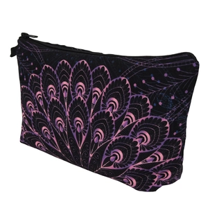 Detail view of the purple peacock feather print on a black fabric cosmetics bag