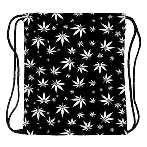 Macro detail of drawstring bag showing high-density white leaf print on black fabric