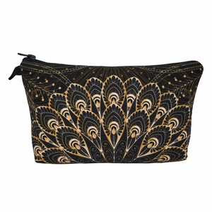 Detail view of Mandala floral print on black fabric makeup bag with golden zipper closure