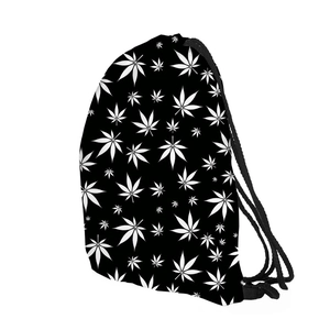 Detail view of the black drawstring backpack featuring white leaf print and durable cords