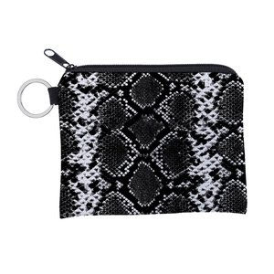 Macro shot of faux snakeskin coin purse with metallic key ring and durable black zipper