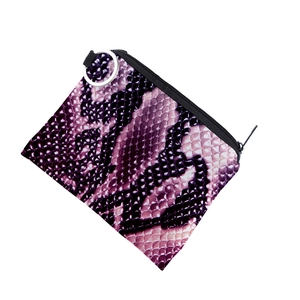 Detail view of mini wallet featuring purple snake skin print and metallic keychain ring