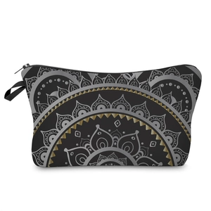 Detail of bohemian mandala print cosmetic bag with gold and silver patterns