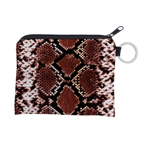 Macro detail of snakeskin pattern coin purse with black zipper and metal keychain ring