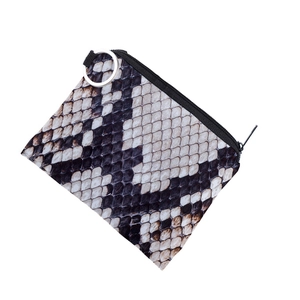 Close-up of snakeskin print coin purse with top zipper and silver metal ring connector