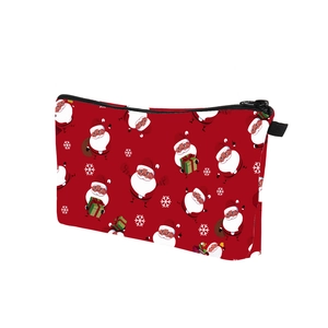 Detail view of the durable black zipper and top handle on the red Christmas pouch