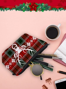 Christmas reindeer plaid makeup bag on desk with coffee, notebook and stationery