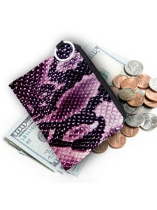 Detail view of purple snakeskin pattern coin purse with silver zipper over cash