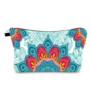 Detailed view of colorful mandala pattern makeup bag with black zipper and fabric puller