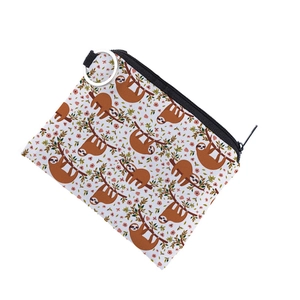 Close-up of waterproof sloth pattern coin purse with metal ring and black zipper detail