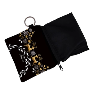 Close-up of Christmas coin purse with golden reindeer and Merry Christmas print