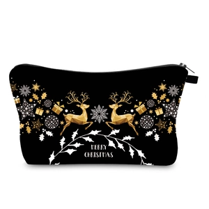 Detailed view of black Christmas makeup bag with gold reindeer and Merry Christmas print
