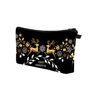 Detail showing the Merry Christmas print and reindeer motif on the black zipper pouch