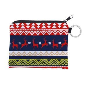 Close-up of Christmas coin purse with reindeer pattern, zipper closure, and key ring