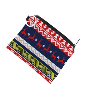 Detailed view of Christmas canvas coin purse with reindeer pattern and zipper