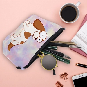 Travel cosmetic bag with cartoon corgi print and purple watercolor pattern on a desk