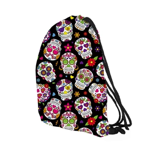 Detail of Mexican sugar skull pattern on black drawstring backpack with woven ropes