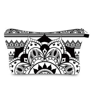 Mandala pattern toiletry bag with black and white geometric print and zipper closure