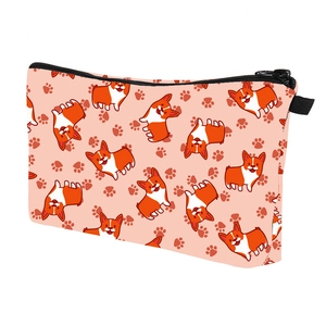Detail of waterproof makeup bag with cartoon corgi pattern and black metal zipper closure