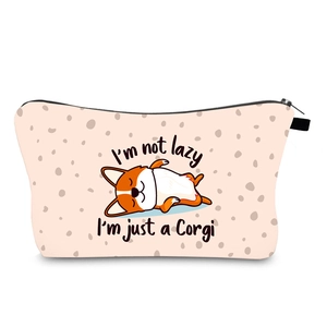 Detail of waterproof toiletry bag showing cartoon Corgi print and I am not lazy text