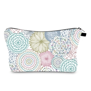 Close-up of waterproof mandala floral toiletry bag with black zipper and handle